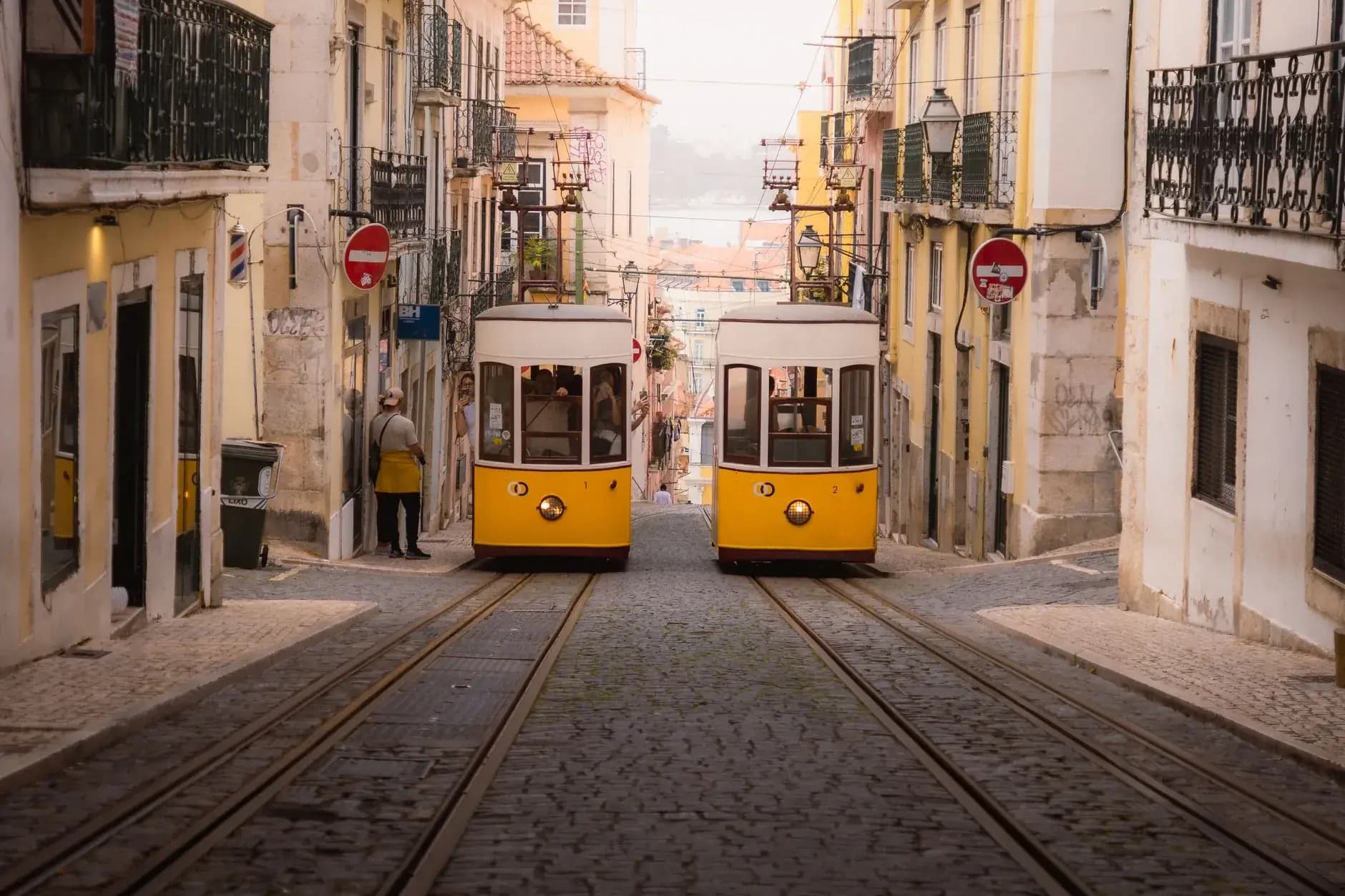 A yellow tram in the Alfama district of Lisbon on a private Portugal tour
