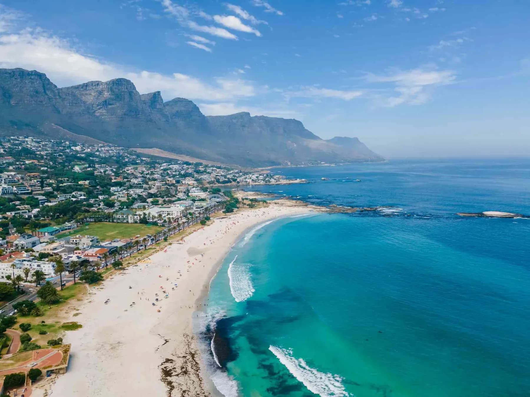 White sand beach below the Twelve Apostles mountains in Cape Town, South Africa