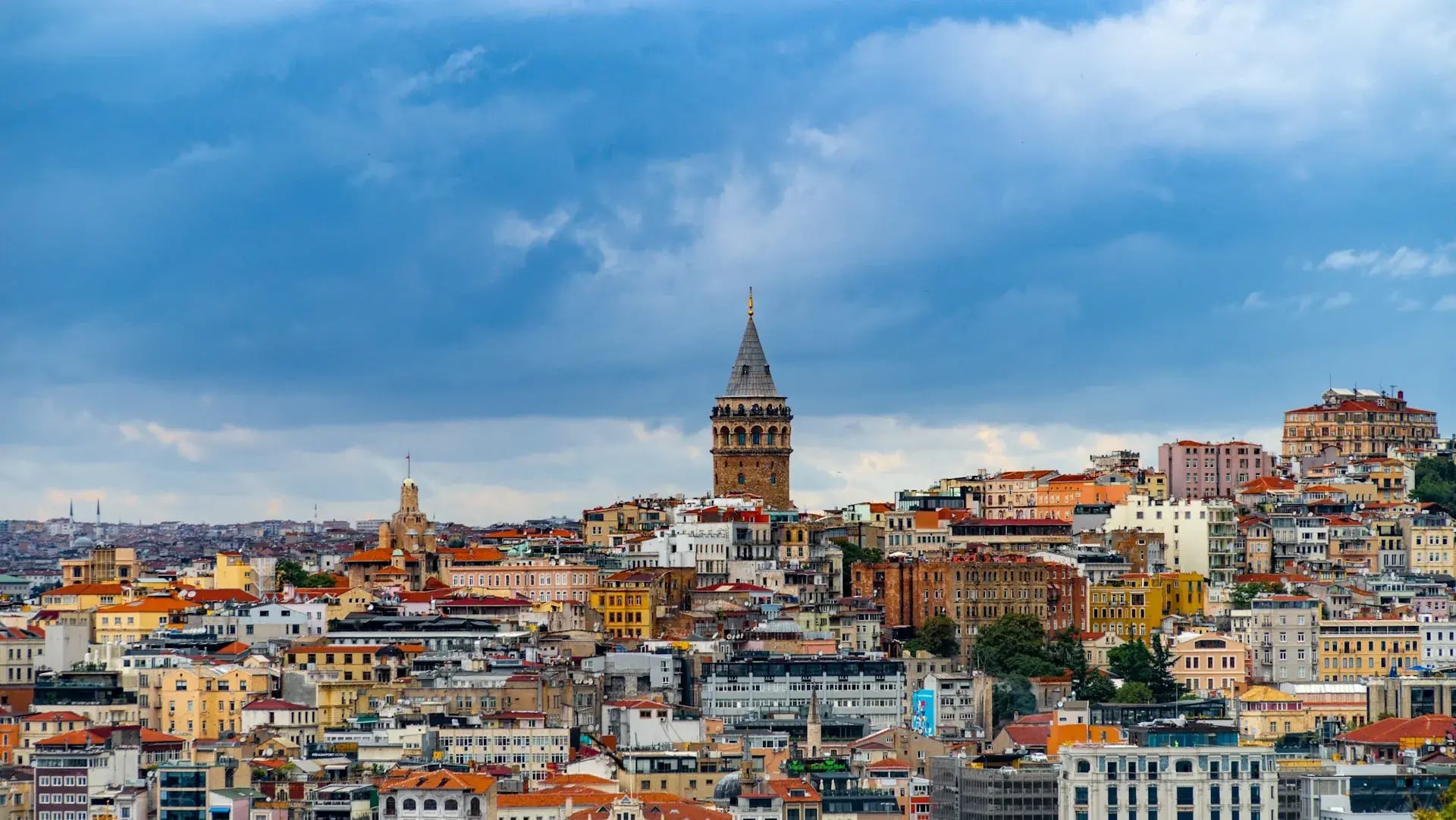 The Galata Tower rising above Istanbul's rooftops with the Golden Horn beyond