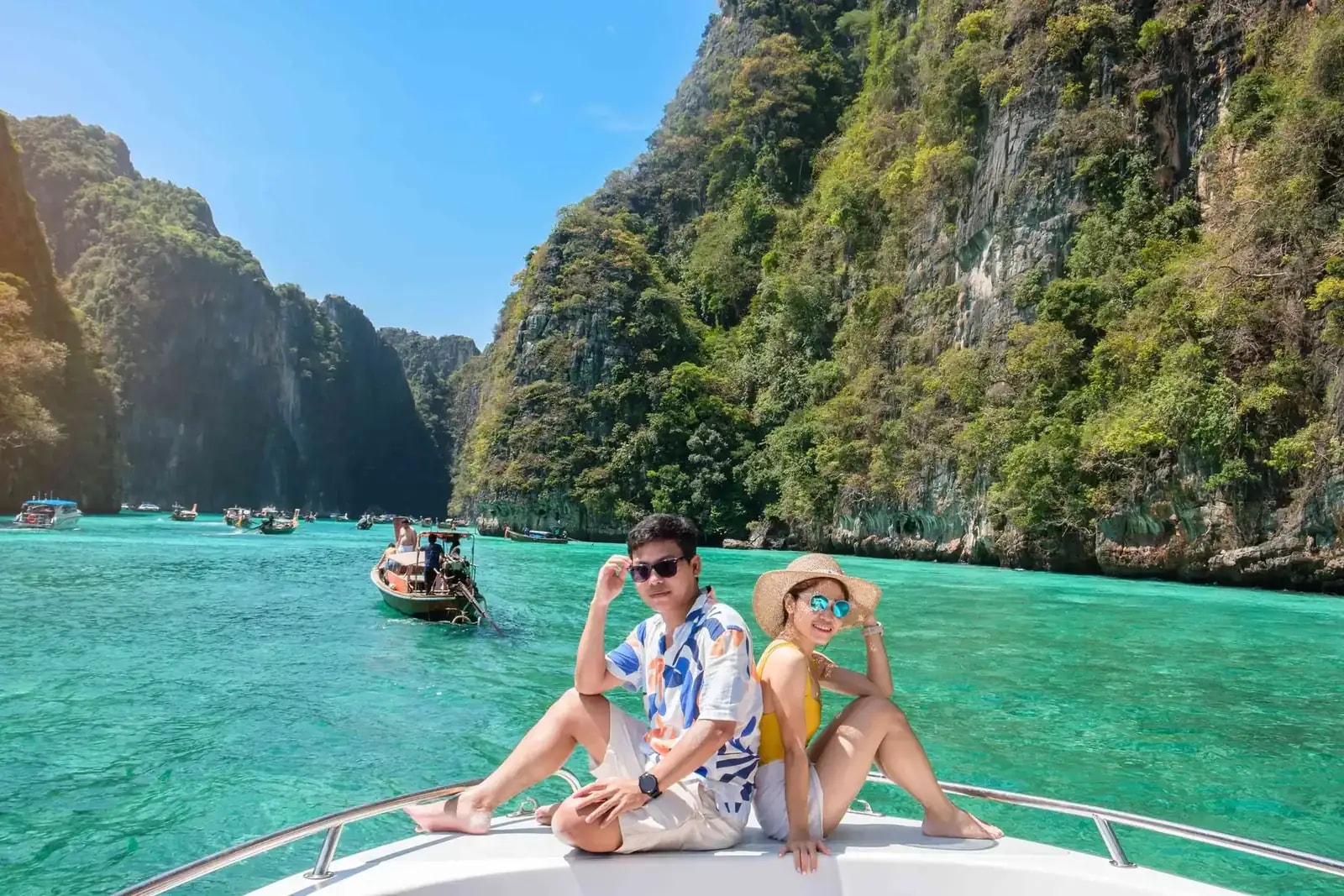 Longtail boat between the limestone cliffs of the Phi Phi Islands, Thailand